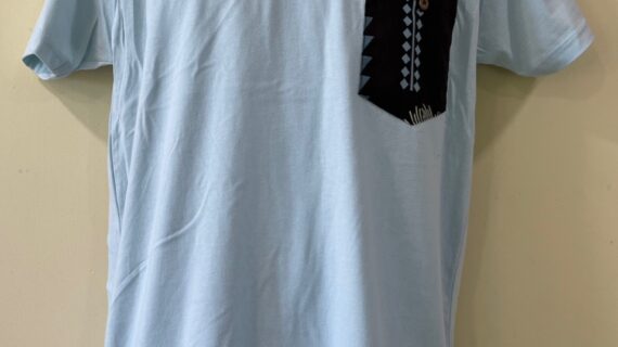 Aleka char on light blue tee